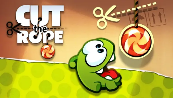 Cut the Rope game cover with Om Nom reaching for candy